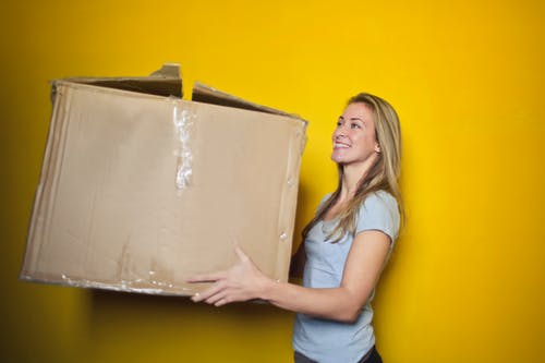 Woman carrying a huge box